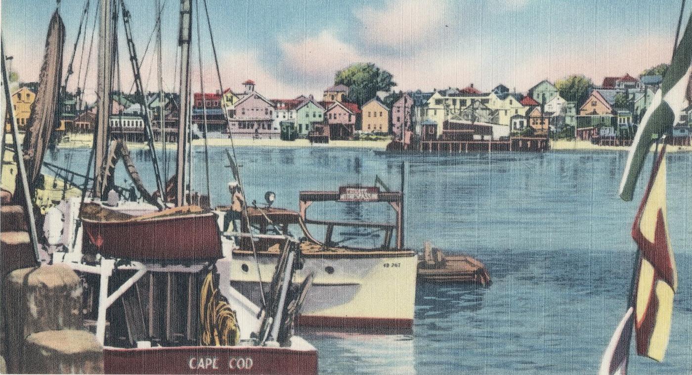 Postcard: fishing boats at the wharf, the painted houses of the Provincetown waterfront across the water