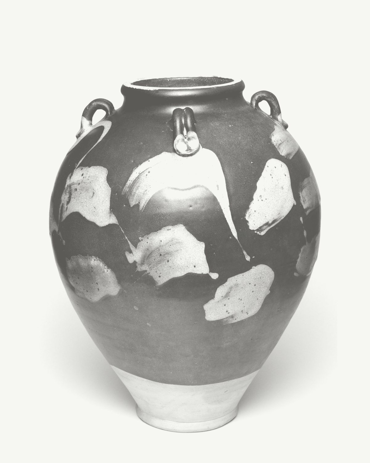 A round-shouldered stoneware jar with four small lugs, dark glaze splashed with pale patches, on a white wall (sample listing, museum object)