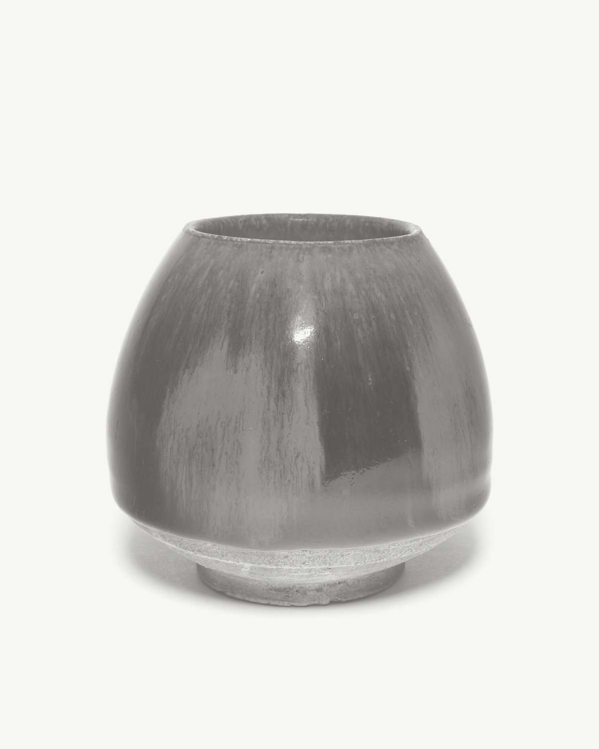 A squat stoneware jar with a streaked dark glaze and a pale foot (sample listing, museum object)