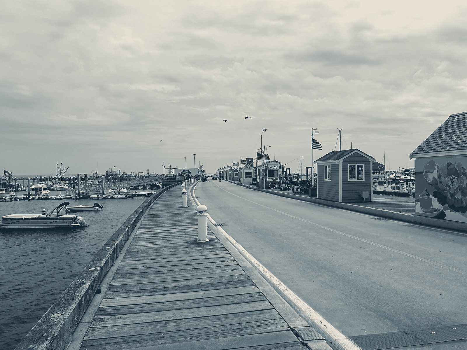 MacMillan Pier, Provincetown: the long timber deck, ticket huts and the harbor on the left