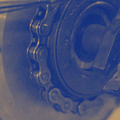 The rear sprocket, its teeth in the chain