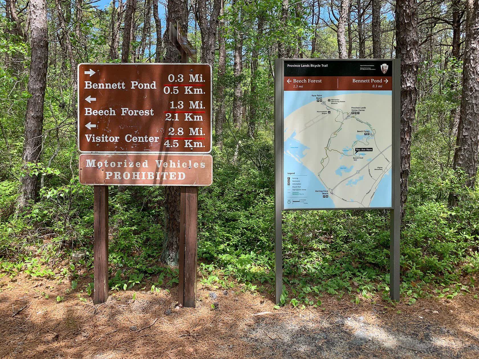 Trail signs to Bennett Pond, Beech Forest and the Visitor Center on the Province Lands Bike Trail