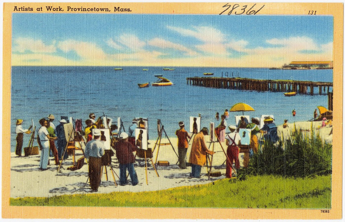 Postcard: painters at easels in a row on the beach at Provincetown, a long wharf behind them.